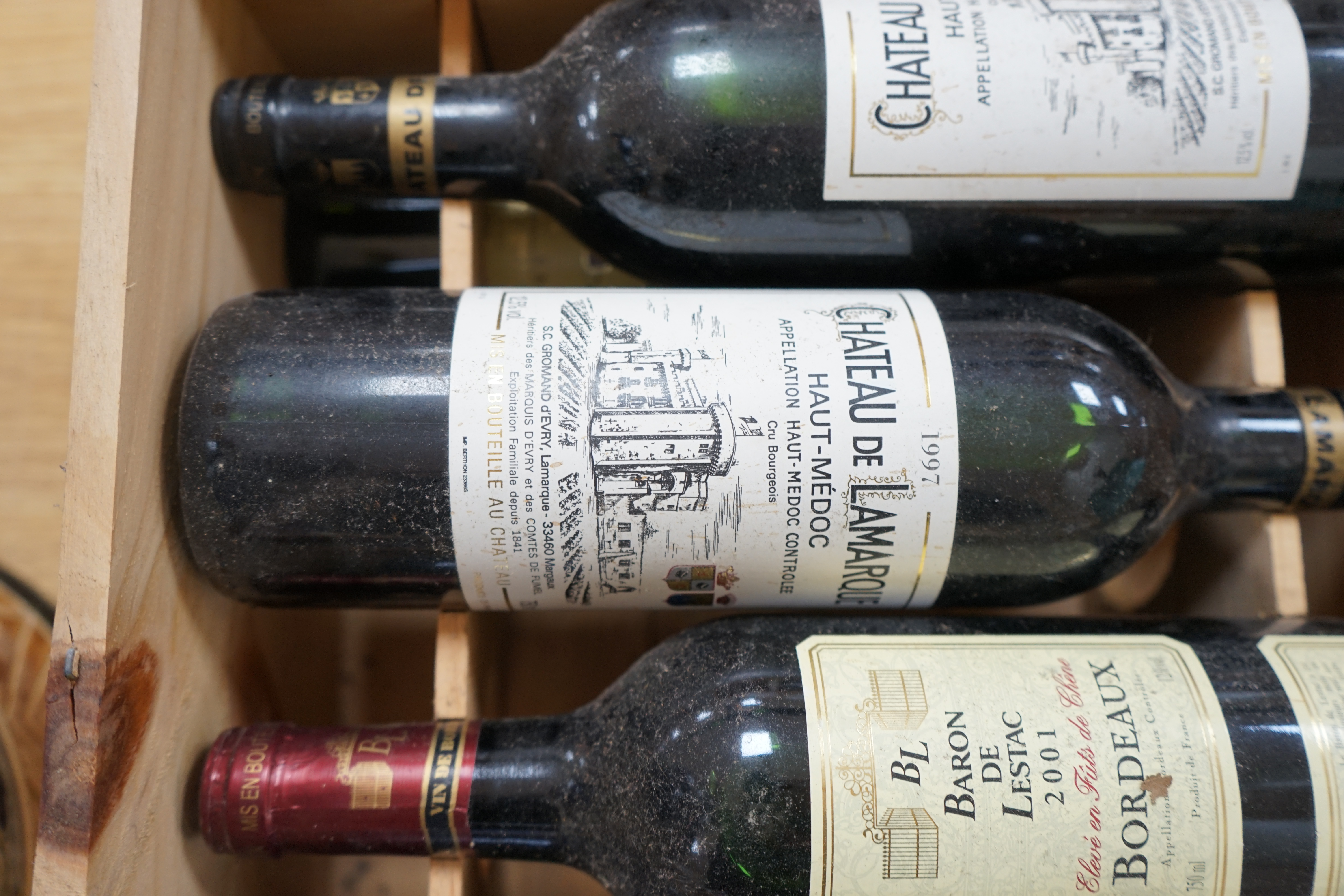 Ten bottles of mixed red wine to include three Château Leoville Barton 1992, in an open crate. Condition - fair to good, storage history unknown.